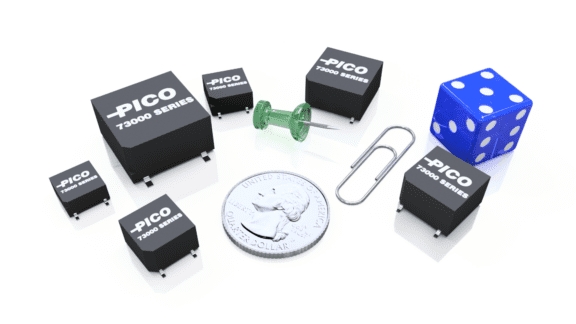 Various sizes of Pico 73000 series electronic components alongside a thumbtack, a paperclip, a die, and a U.S. quarter for scale.