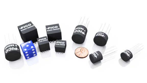 A group of Pico branded electronic components, a blue die, and a penny are arranged on a white surface.