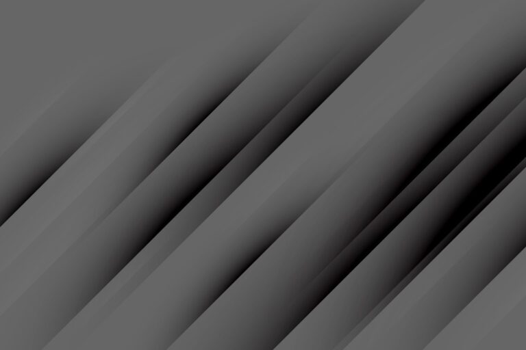 Abstract image of overlapping dark gray diagonal stripes creating a layered effect.