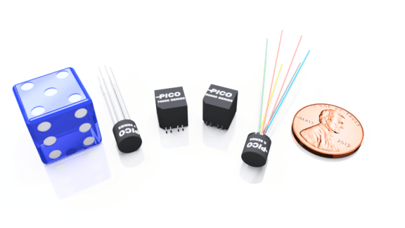 A blue translucent die, two small cylindrical components with pins, two black square components labeled "PICO," multicolored wires, and a 2019 U.S. penny are arranged on a white surface.