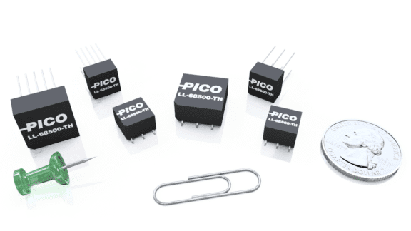 A collection of six black electronic components labeled "PICO" with a green thumbtack, a silver paperclip, and a U.S. quarter for scale.